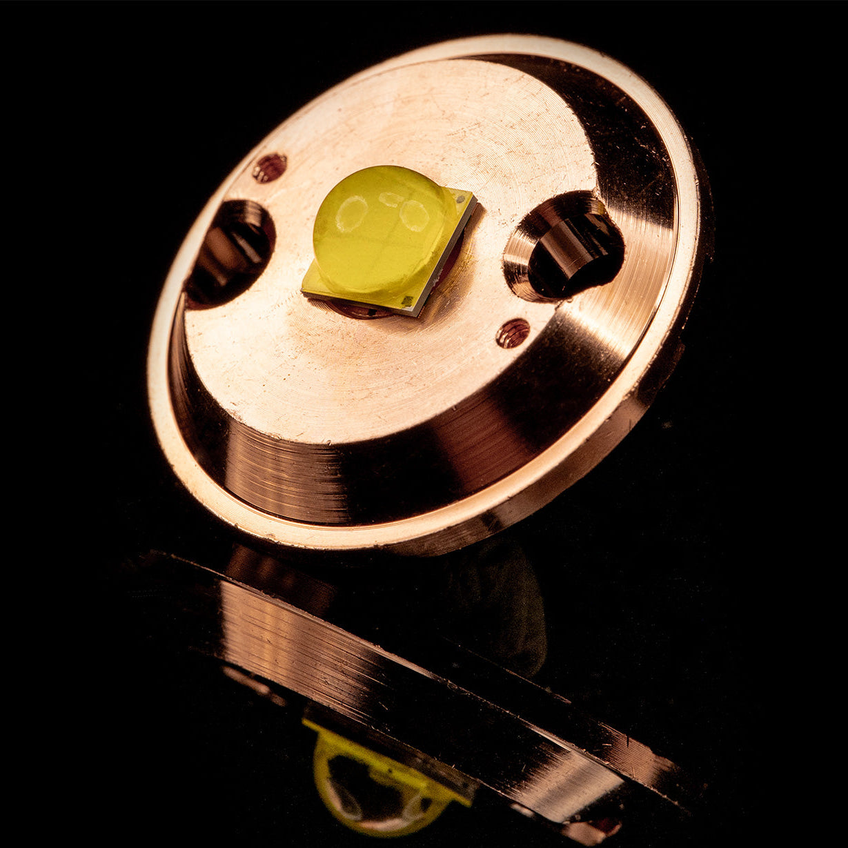 Detailed view of the high-intensity LED and integrated copper heatsink from DeepWater Exploration's aquaLUX subsea light. This highlights the advanced thermal management design for superior lumen output and reliability in demanding deep sea conditions. Essential lighting technology for ROV and AUV operations by dwe.ai.