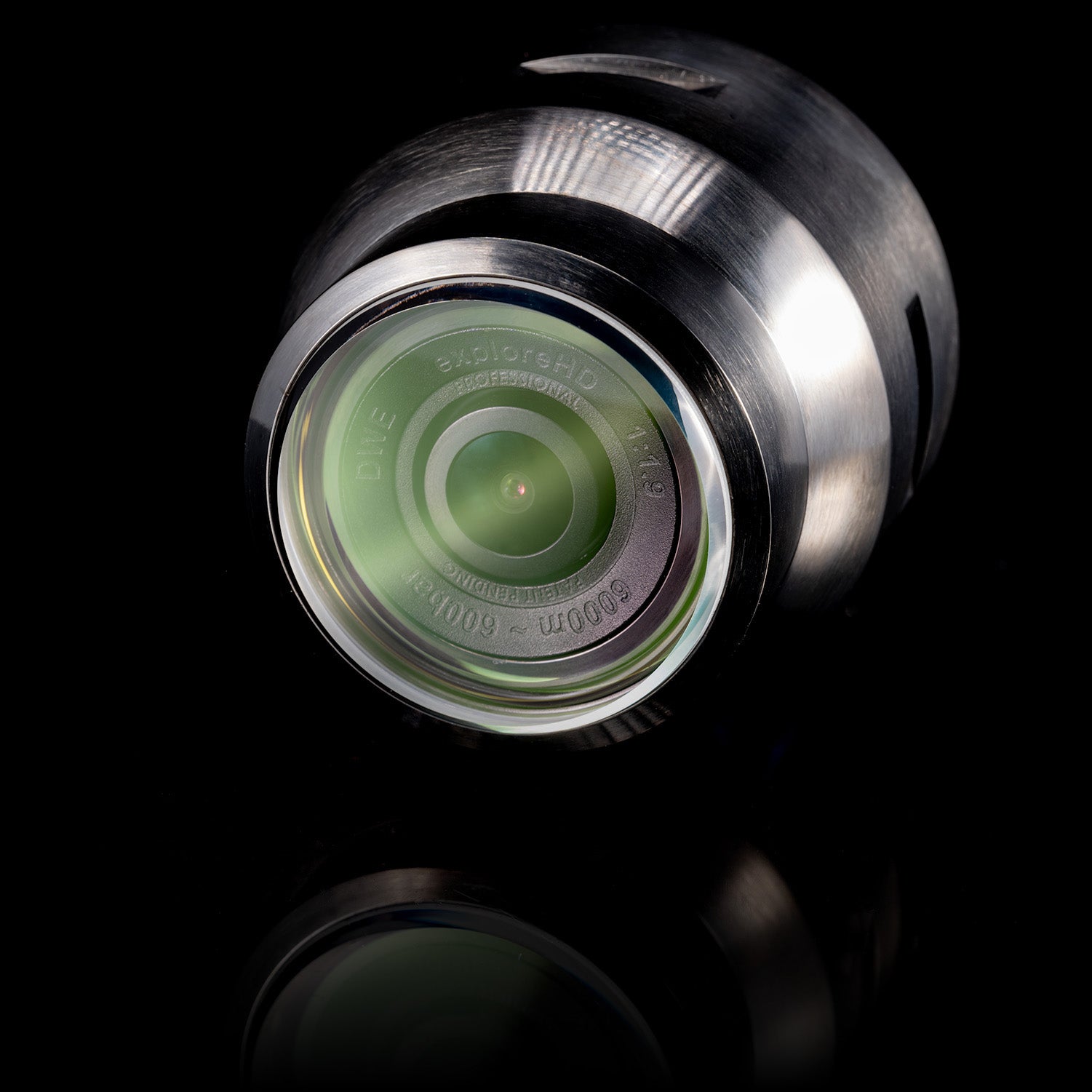 Detailed close-up of the DeepWater Exploration exploreHD Pro subsea camera lens, showcasing its domed, scratch-resistant sapphire front port with internal Anti-Reflective (AR) coating for optimal clarity and durability at full-ocean depths.