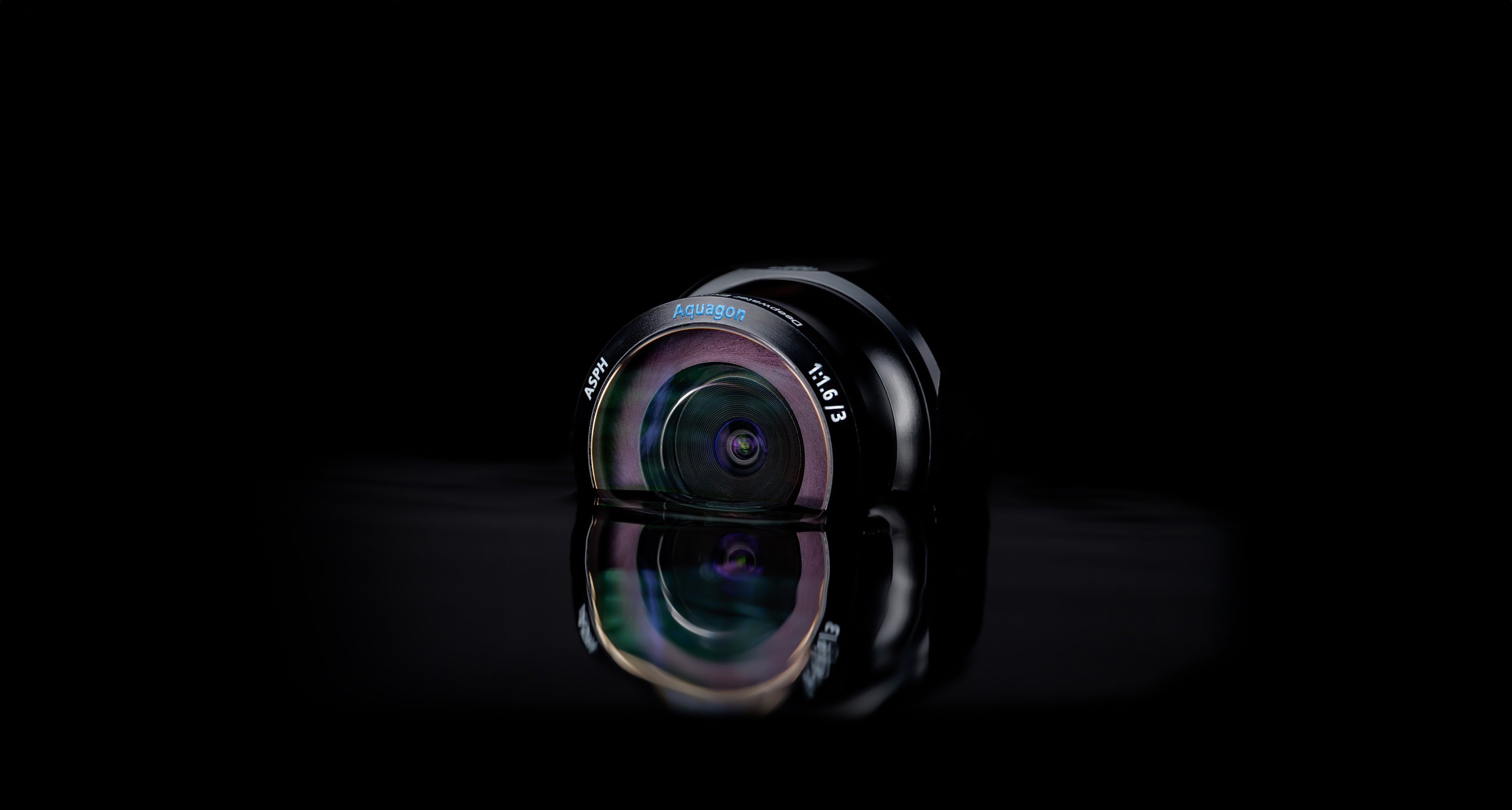 The Aquagon™ ASPH 1.6/3 underwater imaging lens, designed for high-precision subsea vision systems, featuring an anti-reflective sapphire glass element and a distortion-free optical design. Engineered for ROVs, AUVs, and marine robotics, ensuring superior clarity in deep-sea environments.