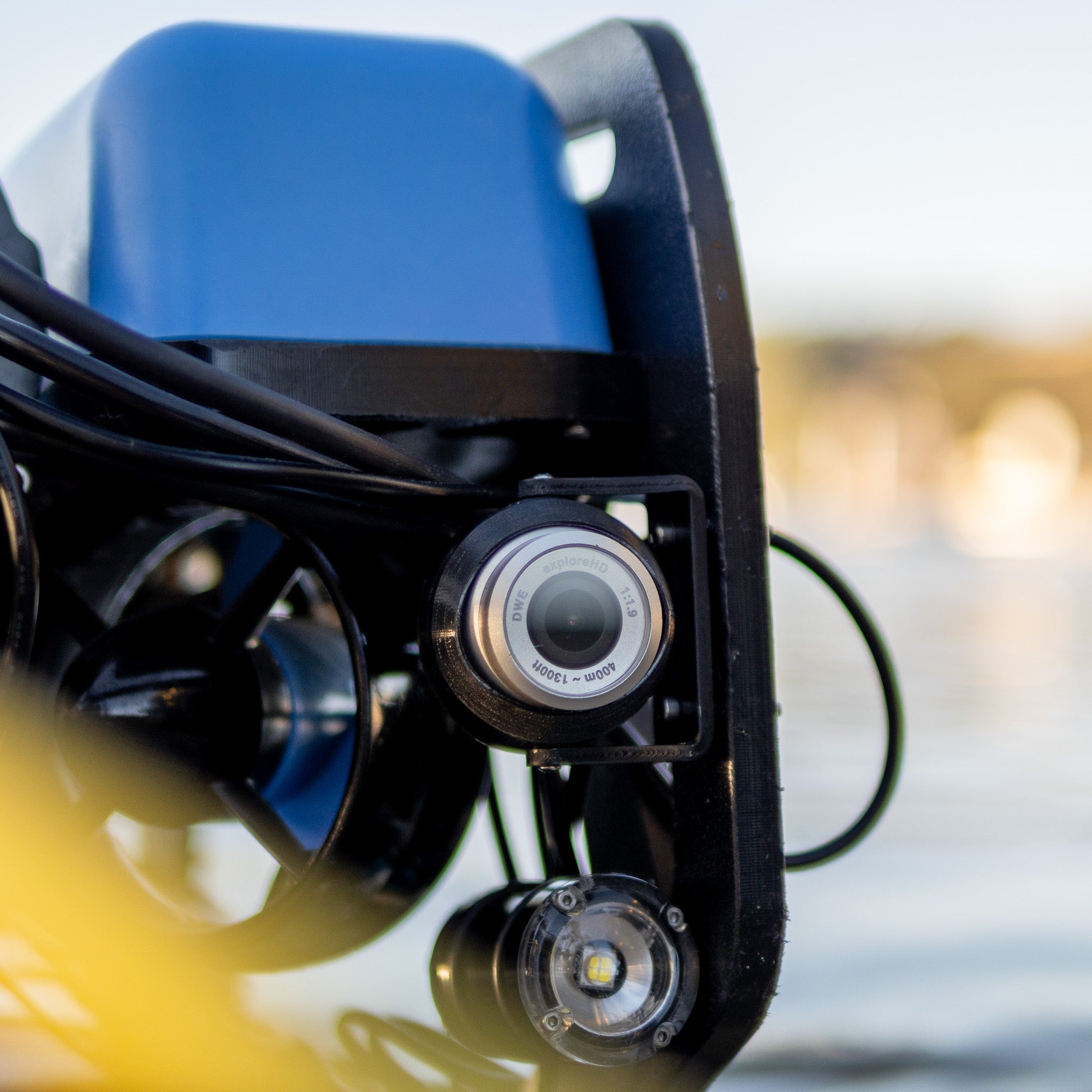 An exploreHD underwater camera mounted on a BlueROV2, a versatile remotely operated vehicle (ROV) used for marine infrastructure inspection, aquaculture monitoring, and search & recovery operations. Designed for harsh environments, featuring corrosion-resistant optics and real-time video streaming.