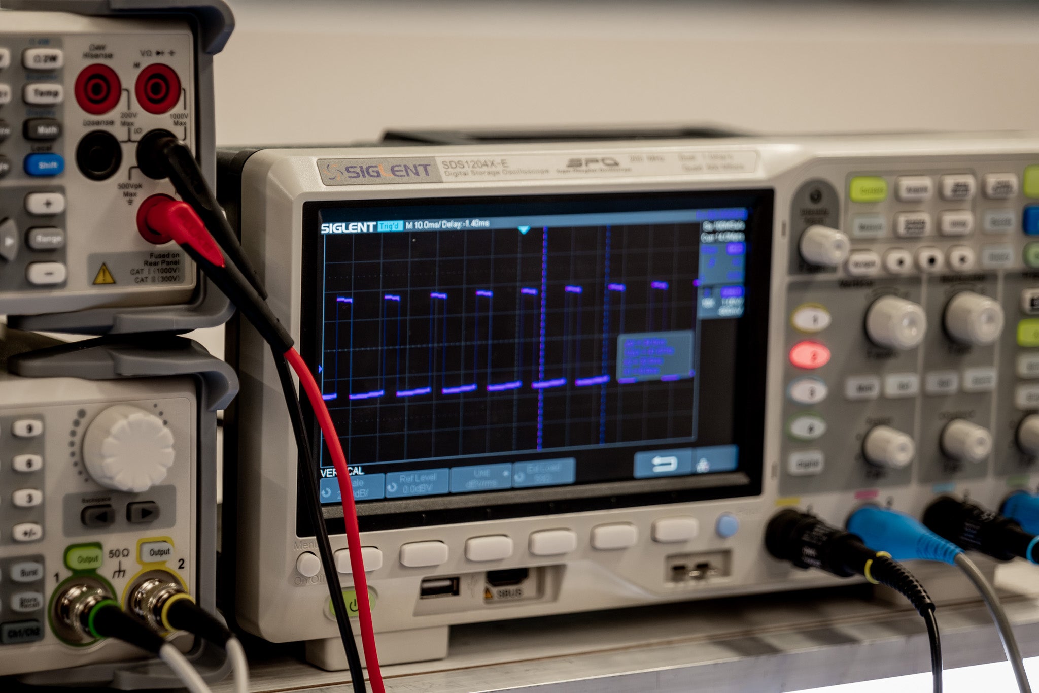 A digital oscilloscope measuring signal waveforms, used in the development and testing of underwater vision systems for ROVs, AUVs, ASVs, and rugged aerial drones. Essential for ensuring low-latency image processing and real-time data acquisition in extreme environments.